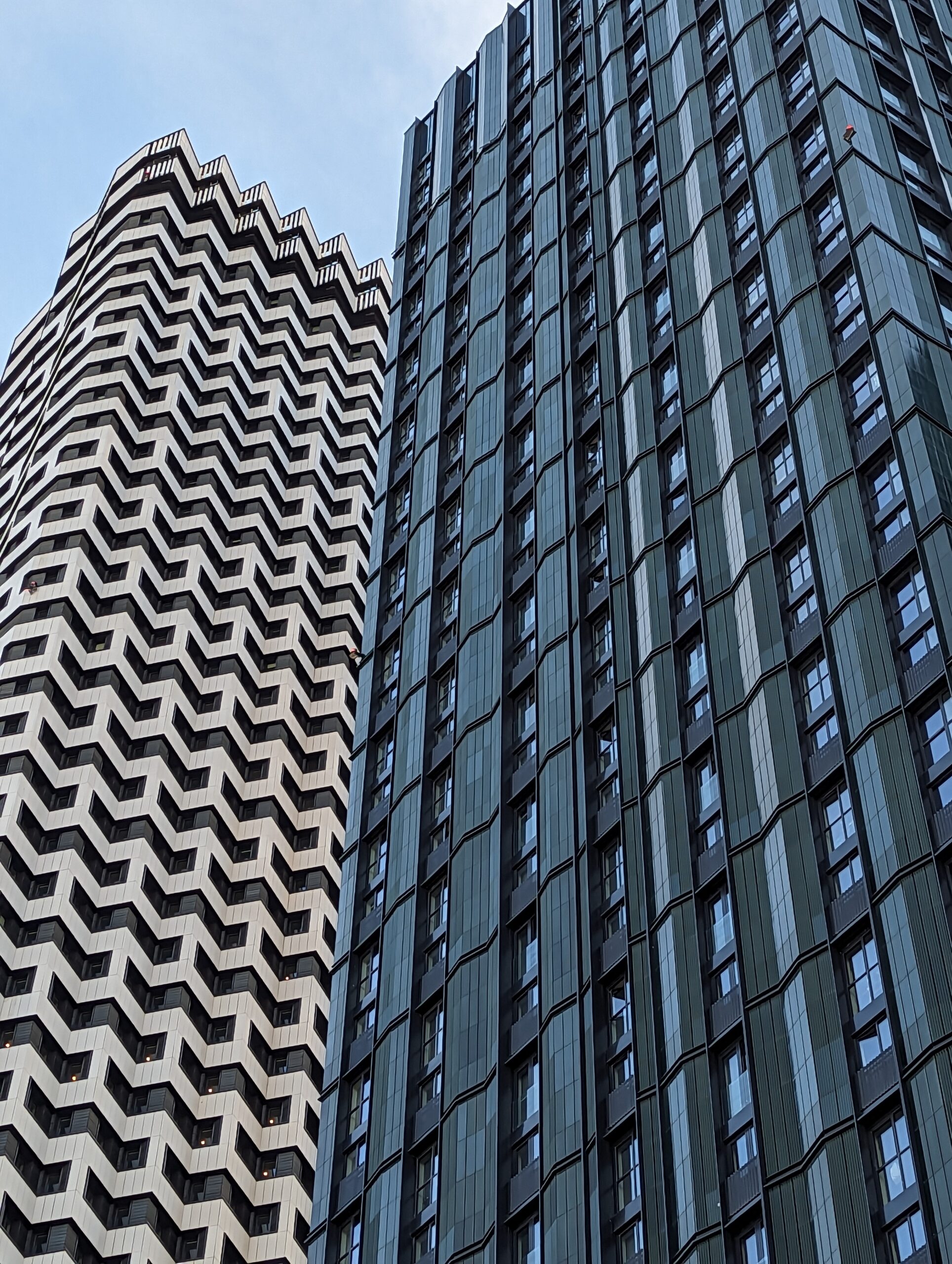 Tall building with a repeating zig-zag pattern across its façade